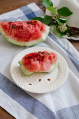 Slices of a watermelon on plate on a table