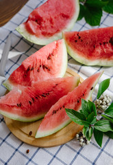 Slices of a watermelon on plate on a table