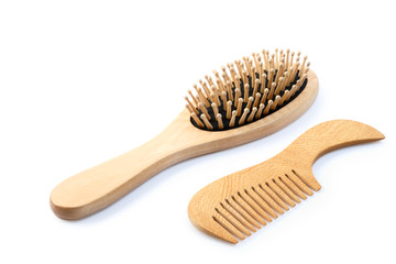 Wooden comb brush isolated with clipping path.