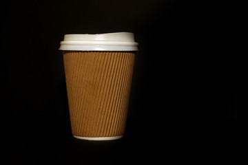 Coffee cup on black background