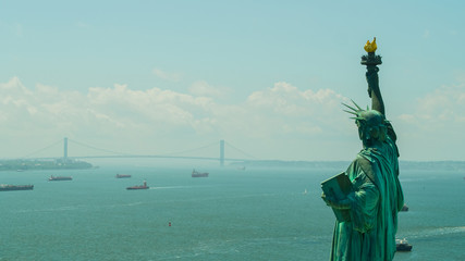 Aerial image of the Statue of LIberty overlooking the harbor © Felix Mizioznikov