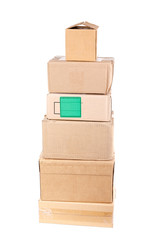 Vertical stack of old packing boxes with qubic box on top
