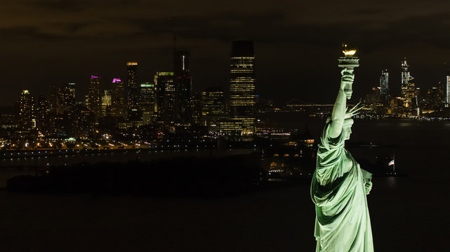 Statue of LIberty night aerial with city view background