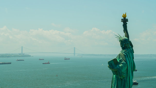 Aerial image of the Statue of LIberty overlooking the harbor