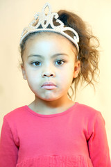 Little girl in pink dress and tiara