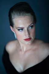 Vintage 1950s woman in black evening gown. Headshot.