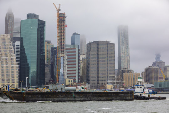Image of New York City with a passing barge