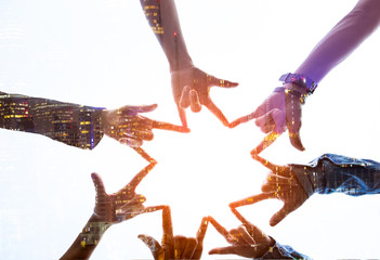 Double exposure ofTeamwork Concept,Group of diversity people to greeting power tag team,Teamwork Join Hands Partnership Concept of people putting their hands together,Friends with hands showing unity.