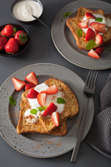 french toasts with yogurt and strawberries for breakfast