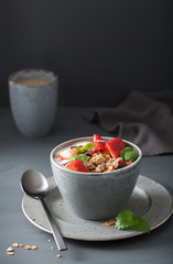 granola and yogurt with seeds and strawberry for breakfast