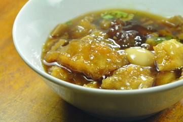 braised fish maw in red gravy on bowl