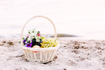Fototapeta na wymiar Basket on the sand on the sea shore