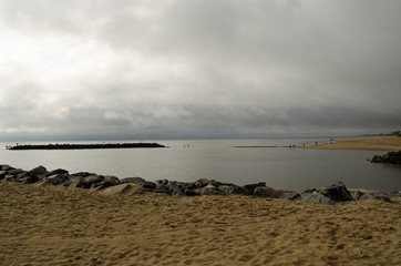 Island with cloudy sky background. Coastline, water
