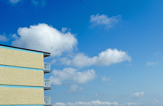 Brown Building  With Blue Sky Background