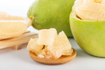 fresh and peeled pomelo(shaddock), grapefruit with slices isolated on white background