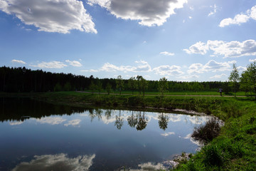 reflection of clouds in a pond