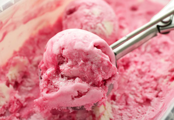 Scoop with delicious strawberry ice-cream, closeup