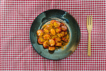 Tasty german sausage served with sauce