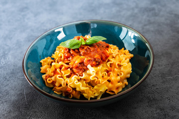 tasty fusilli pasta Italian meat sauce pasta on the table