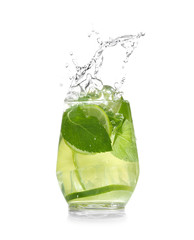 Glass of fresh mojito with splashes on white background