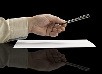 hand holding a metal pen (clipping path)