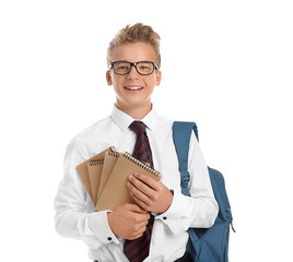 Teenage boy with backpack and notebooks on white background