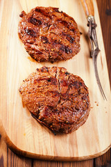 food meat -  beef steak on wooden board