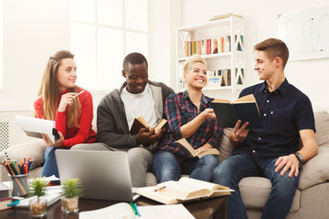 Group of diverse students studying at home atmosphere on the cou