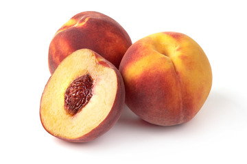Fototapeta na wymiar Fresh ripe peaches and and juicy slice with bone, isolated on white background.