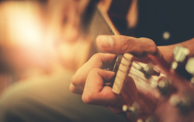 hand playing acoustic guitar, close up on musical instrument Relaxation Music sound hobby passion...