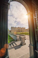 Bialystok, Poland, April 30, 2018: View through the arch of a metal pergola at Branicki Palace