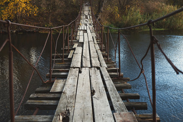 Fototapeta premium Old abandoned wooden bridge across river