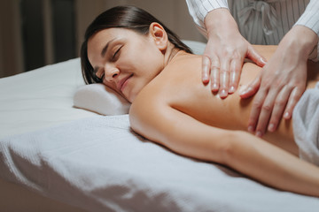 Obraz na płótnie Canvas Woman Enjoying a Back Massage .