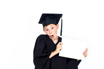 A boy in a student hat holding an empty Billboard . Knowledge, education and successful career.Isolated on white background.Portrait of a confident smart boy.