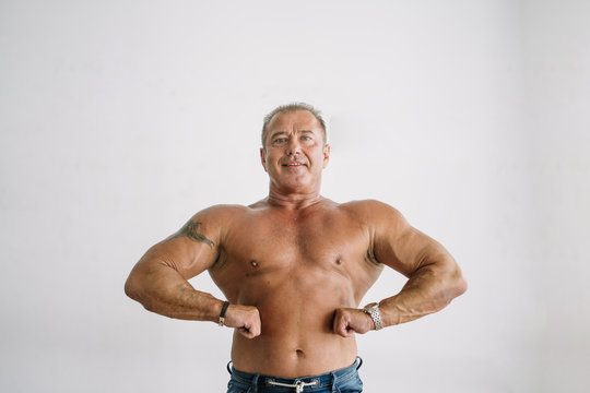 Muscular older man posing