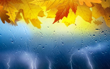 Fall seasonal collage - yellow and orange leaves, powerful lightnings in dark stormy sky