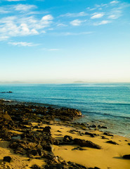 Canarian coast, beach, rocks, and Atlantic Ocean.
