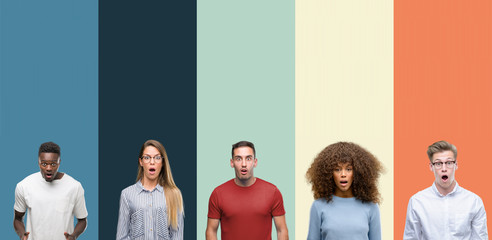 Group of people over vintage colors background afraid and shocked with surprise expression, fear and excited face.