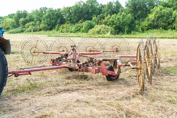 Tedders for hay in the meadow