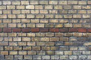 Brick wall with bicolor yellow and brown bricks