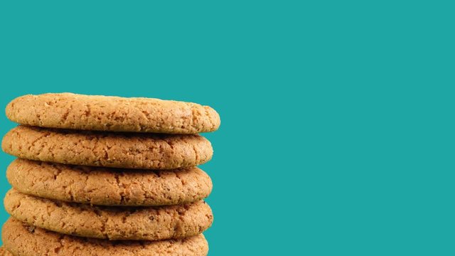 A stack of cookies rotates against a color blue background.