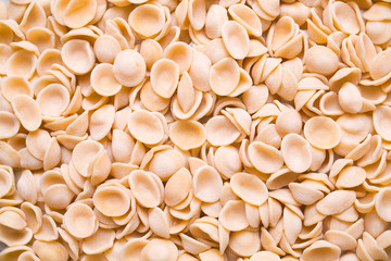raw uncooked italian orecchiette pasta food background