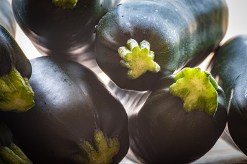 Close up on a fresh crop of raw green zucchini vegetables, summer squash.