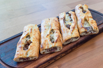 Turkish Bafra Pide with Minced Meat Kavurma Salad and Pickles.