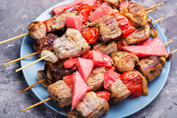 Shish kebab with watermelon garnish