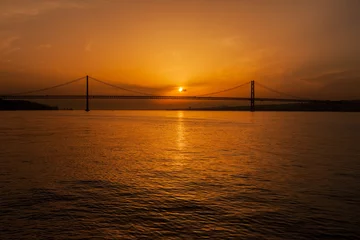 Zelfklevend Fotobehang 5th of April Bridge on Tagus River at Sunset in Portugal © Artur Bogacki