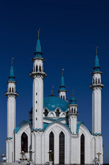 Fototapeta na wymiar beautiful white mosque with blue dome. four high minarets. bright sky
