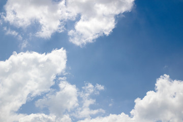 blue sky background with tiny clouds.