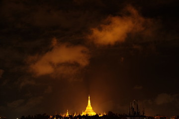Beautiful night sky with two big clouds over the Shwedagon pagoda