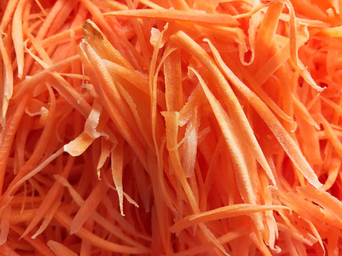 pile of fresh organic shredded carrots for cooking